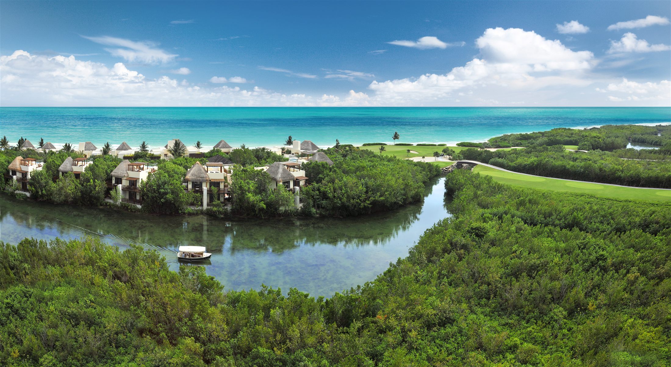 Mangrove canal winding beside the golf course and beach at Mayakoba